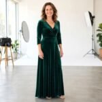 Confident woman in an elegant evening dress smiling at a bright photo studio, natural curves, realistic photo
